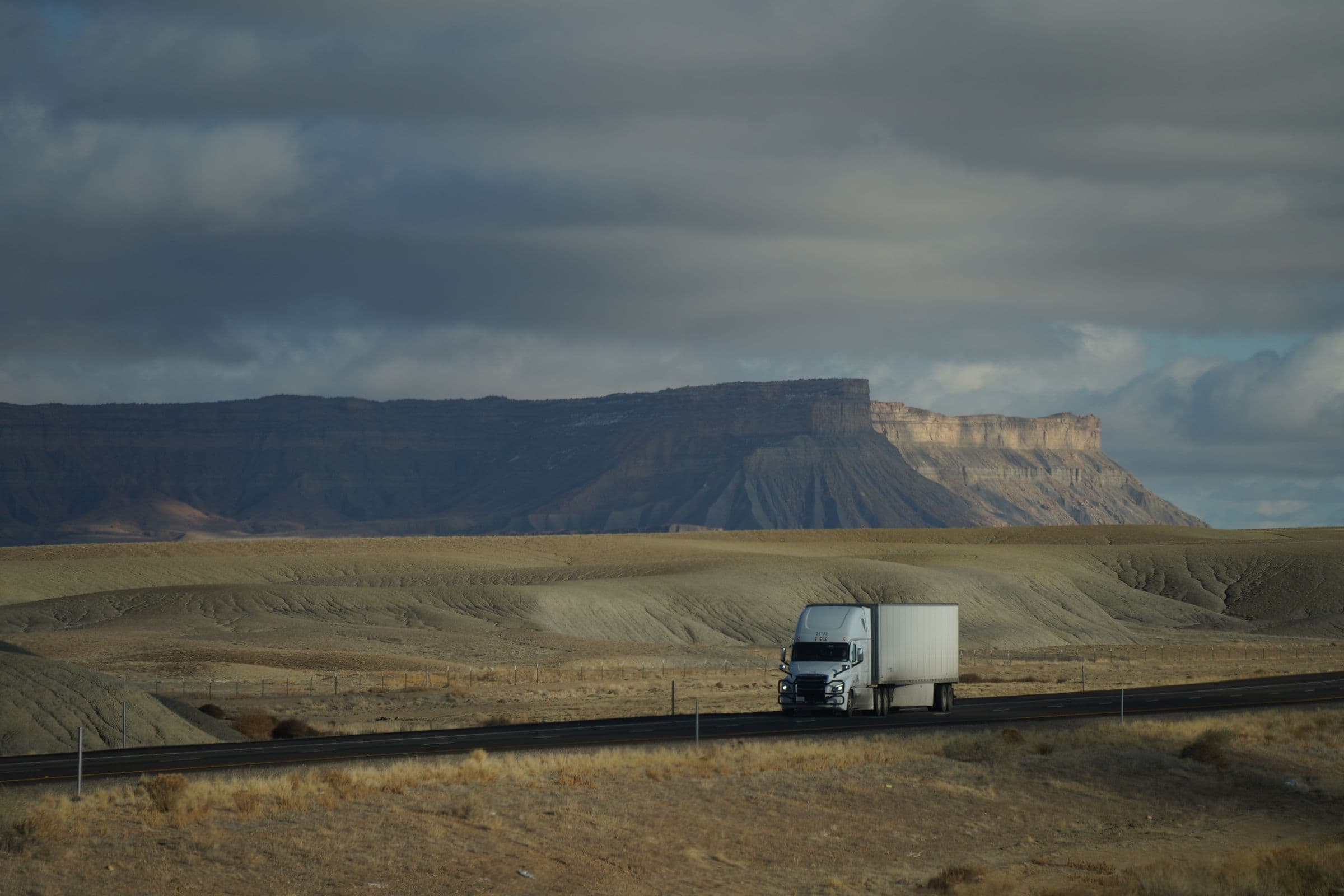 Freightliner Cascadia pulling a 53-foot dry van across the high desert